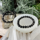 Bracelet Mala en obsidienne argentée avec pochette en velours